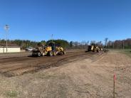 Road grader and a payloader cutting material from the project site. Road grader and a payloader cutting material from the project site.