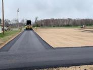 Anderson Brothers Asphalt crew applying the bituminous base course. Anderson Brothers Asphalt crew applying the bituminous base course.