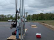 Elite Fence & Deck workers driving fence posts Elite Fence & Deck workers driving fence posts