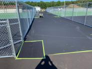 Lee Sports applying (black) base material to the pickleball social area Lee Sports applying (black) base material to the pickleball social area